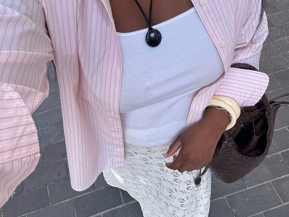 @nnennaechem outfit selfie with pink shirt white tank and white lace skirt