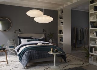 bedroomw ith grey scheme, statement light fitting and deep blue bedding by john lewis and partners