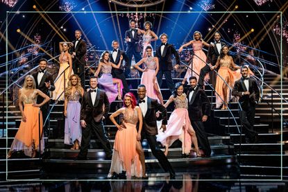 a group shot of the Strictly Come Dancing 2022 professionals posing on the Strictly dancefloor