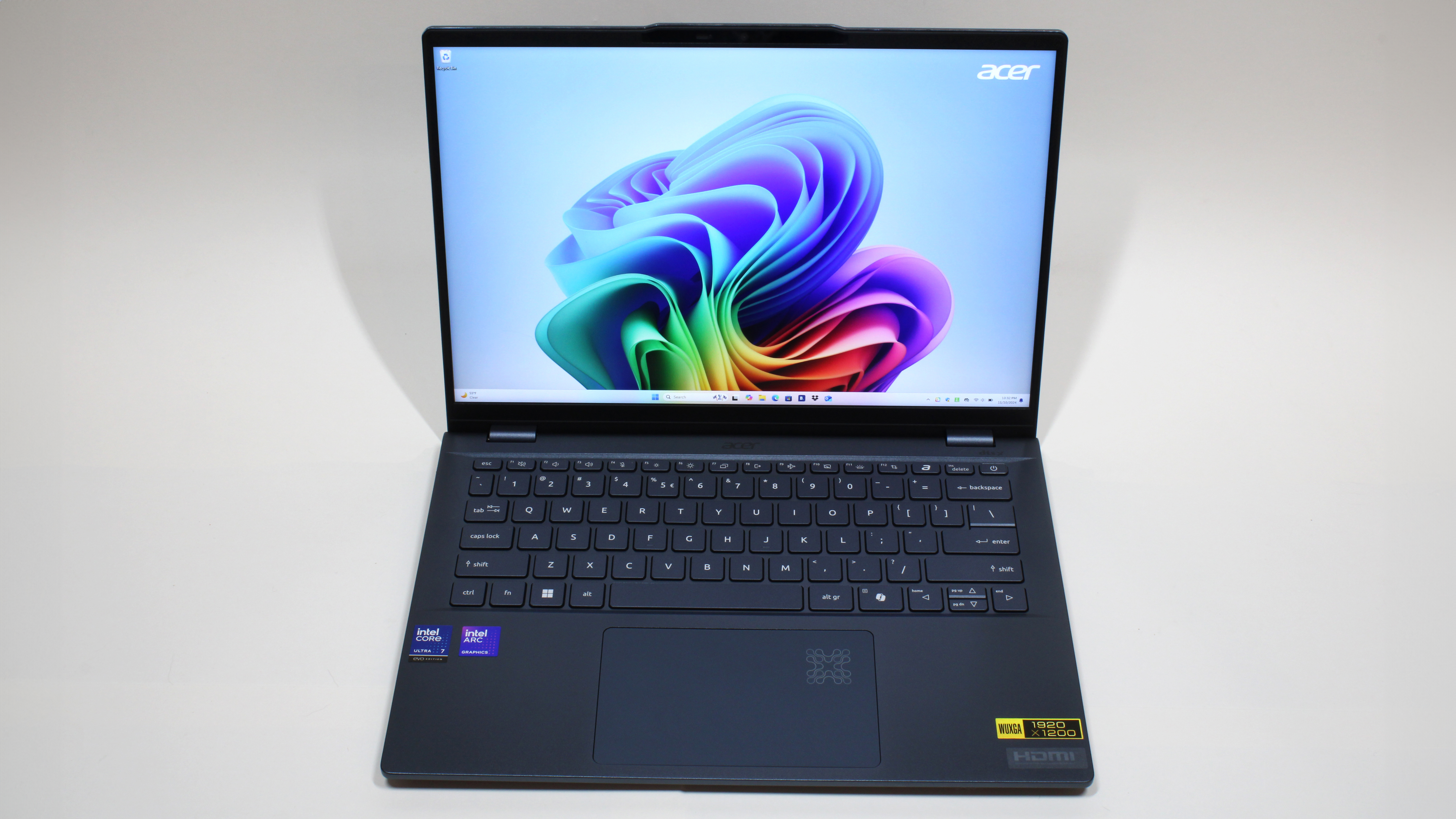 Acer Swift 14 AI (Intel) on a white background open facing directly at the camera to show display, keyboard, and touchpad