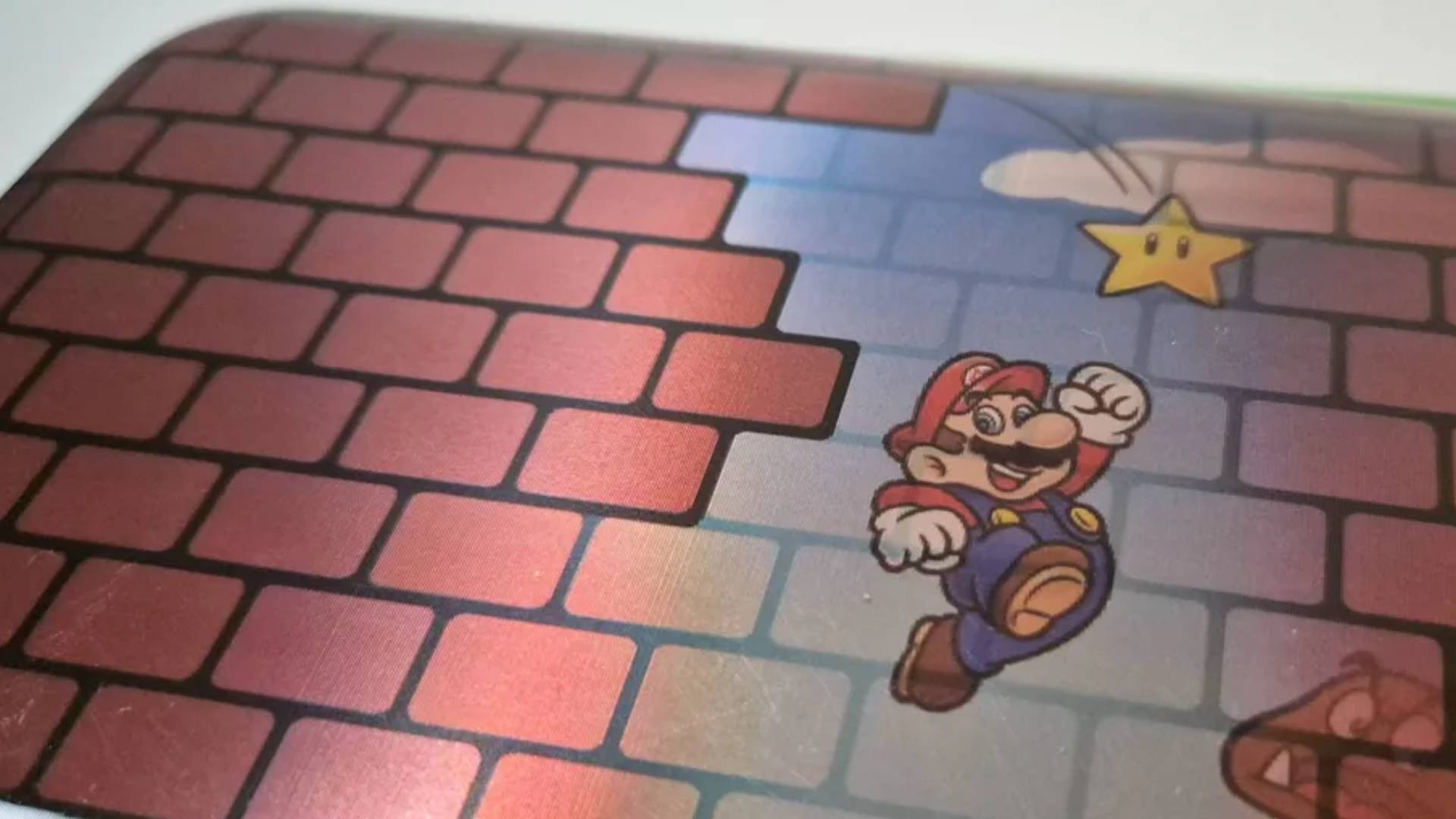 Close up photo of the lenticular cover of the Mario Bricks Turtle Beach PlayTrek Switch 2 Travel Case.