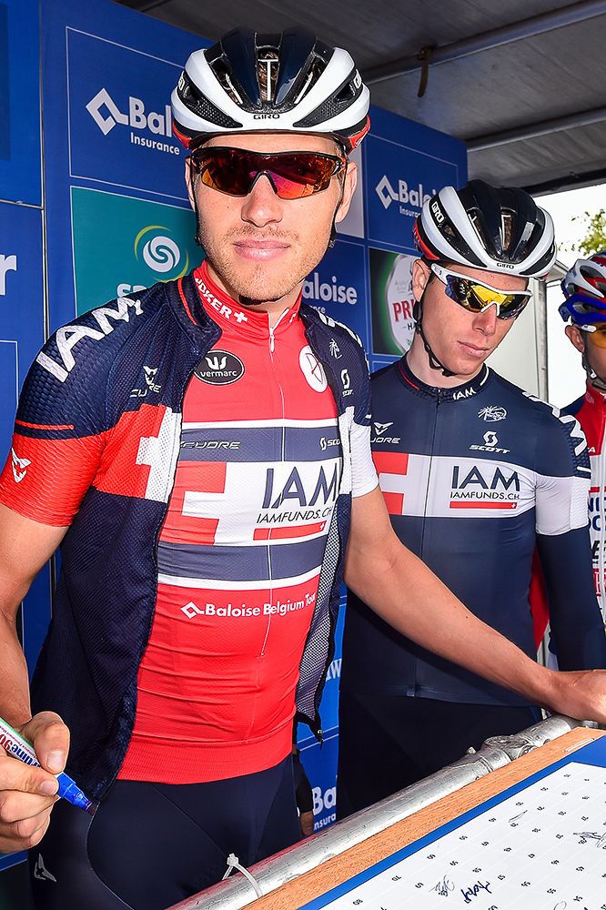 Riders sign in before the final stage in Belgium.
