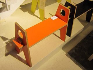A singular small orange wooden step
