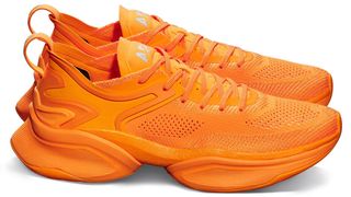 Pair of APL McLaren HySpeed running shoes in orange