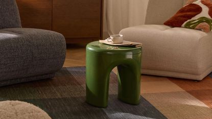 a glossy green table in a living room