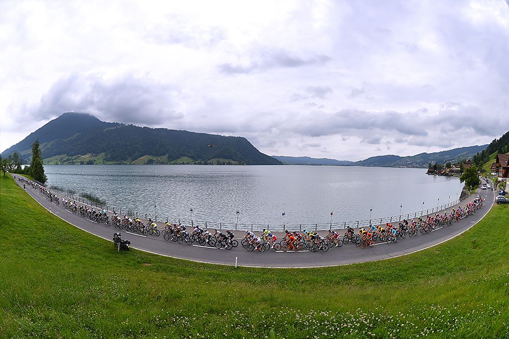 The peloton passes beautiful scenery at the Tour de Suisse