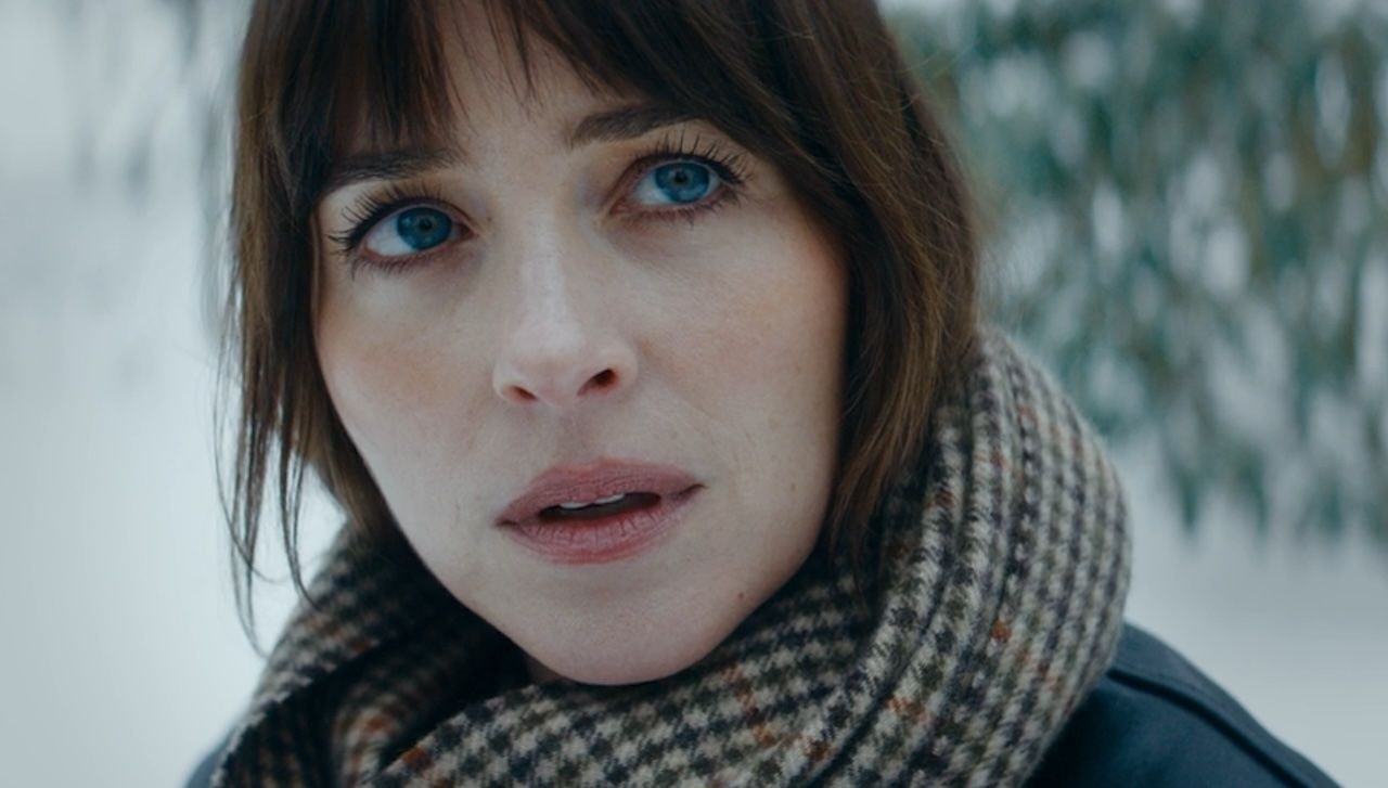 Dakota Johnson outside looking upward in Verity
