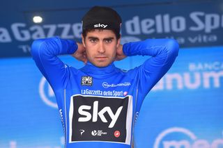Mikel Landa pulling on the climbers jersey after stage 18