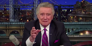 regis philbin behind the late show desk