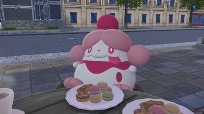 A screenshot of a Slurpuff eating sweets at a cafe in Pokemon Legends: Z-A.