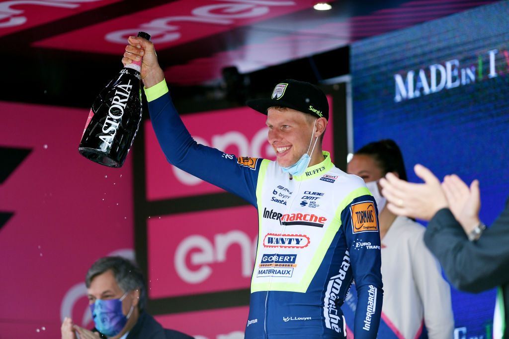 CANALE ITALY MAY 10 Taco Van Der Hoorn of Netherlands and Team Intermarch Wanty Gobert Matriaux celebrates at podium during the 104th Giro dItalia 2021 Stage 3 a 190km stage from Biella to Canale Trophy Champagne girodiitalia Giro on May 10 2021 in Canale Italy Photo by Tim de WaeleGetty Images