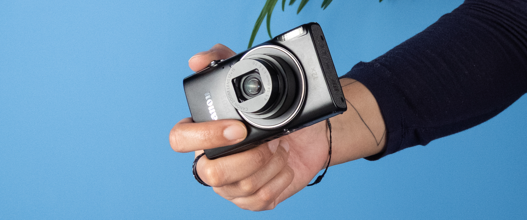 A black Canon PowerShot Elph 360 HS A or a Canon PowerShot IXUS 285 HS A compact camera