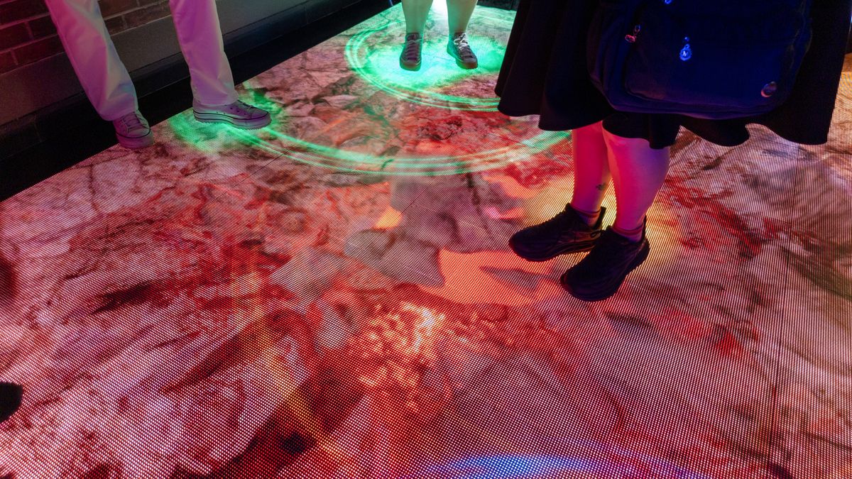 A digital floor display showing a crumbling floor at Google's San Diego Comic-Con Rewards Lab