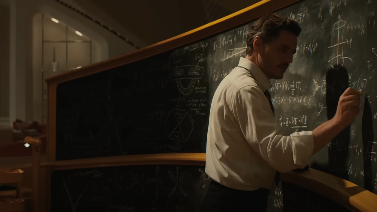 Reed Richards (Pedro Pascal) writes on his chalkboard in The Fantastic Four: First Steps