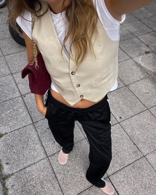 A French fashion influencer wearing the white mesh flats trend