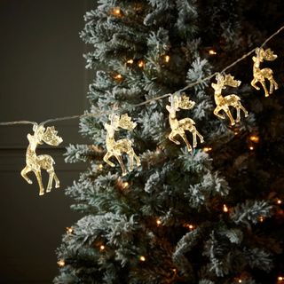 Christmas lights in the style of little reindeer figurines
