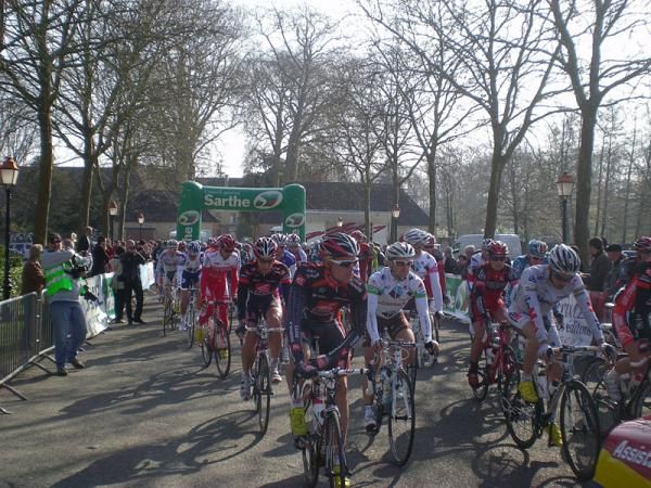 Race leader Luis Leon Sanchez (Caisse d'Epargne) and eventual stage winner Anthony Ravard start the final stage of the Circuit de la Sarthe at the Abbey of Epau.