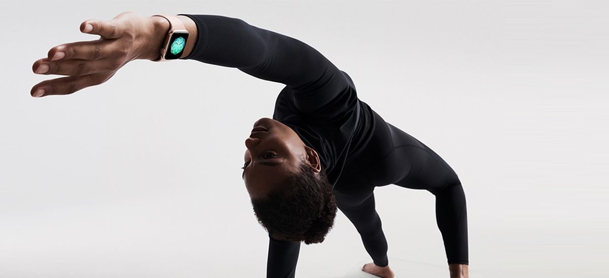 Apple Watch Series 4 worn by man doing yoga