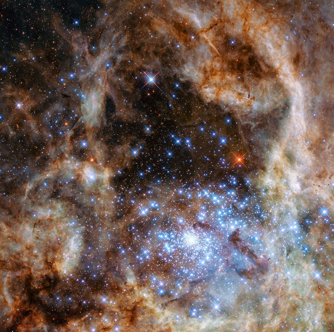 The young and dense star cluster R136 seen at the lower right of an image of the LMC as seen by the Hubble Space Telescope