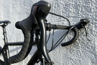 The Brand X Road Bike drop bars and leavers close up