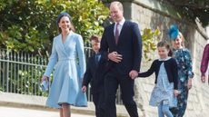 Prince William, Catherine, Prince George and Princess Charlotte attend the traditional Easter Sunday Church service at St George's Chapel in the grounds of Windsor Castle on April 17, 2022