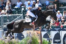 Jessica Mendoza and the syndicate-owned mare In The Air jump clear on day two of the European Showjumping Championships in Spain.