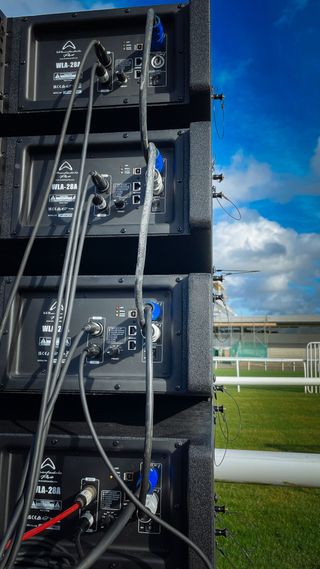 The back of a Wharfdale Pro system sits track side on a sunny day.