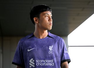 Wataru Endo new signing of Liverpool at AXA Training Centre on August 18, 2023 in Kirkby, England