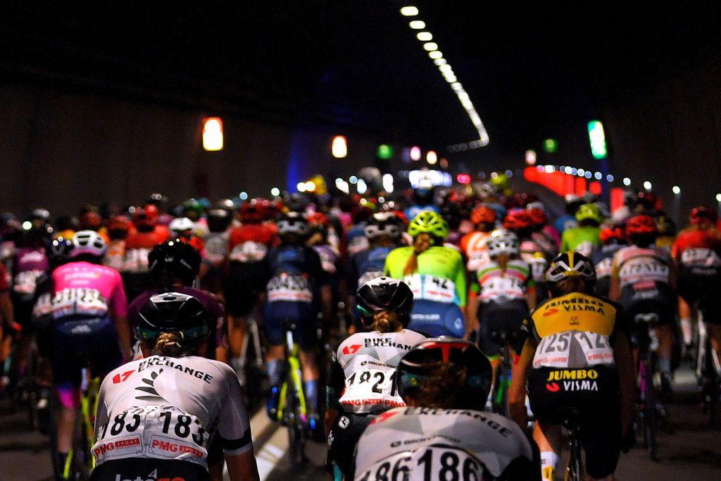 COLICO ITALY JULY 07 Georgia Williams of New Zealand and Team BikeExchange The Peloton passing through a tunnel during the 32nd Giro dItalia Internazionale Femminile 2021 Stage 6 a 155km stage from Colico to Colico GiroDonne UCIWWT on July 07 2021 in Colico Italy Photo by Luc ClaessenGetty Images