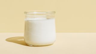 Glass jar of yoghurt