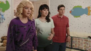 Beverly, Erica and Geoff standing confused in the nursery in The Goldbergs season 10