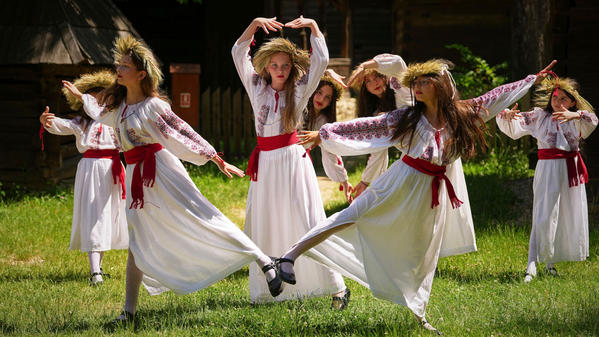 
                                Children dance during the summer solstice in Bucharest, Romania
                            