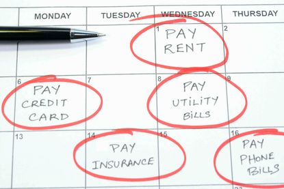 A calendar page with notes to pay rent and utilities.