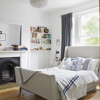 room with bed and wooden flooring