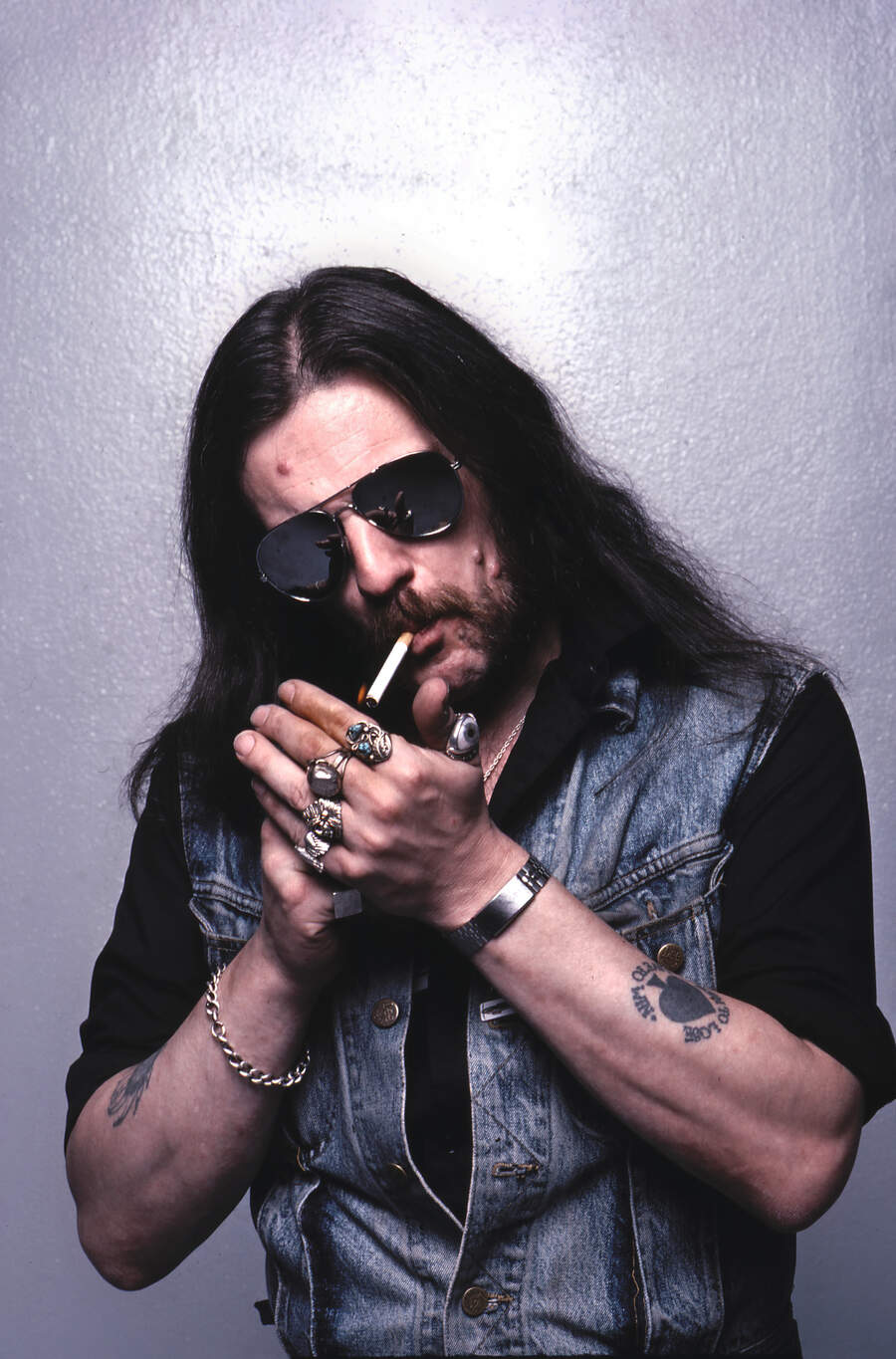 Lemmy in aviator shades, lighting up a cigarette