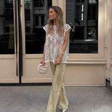 Influencer wears a romantic blouse.