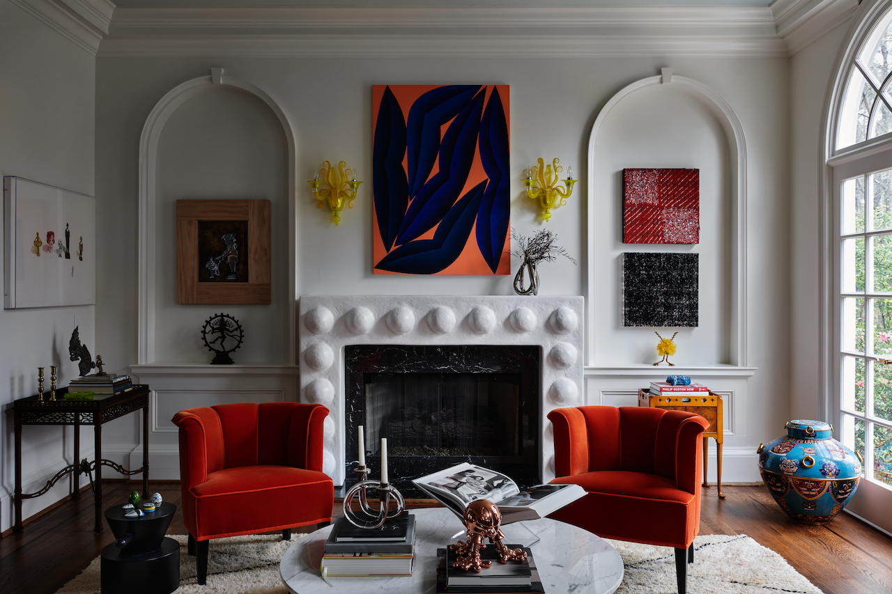 A built in fireplace with a sculptural surround and arches