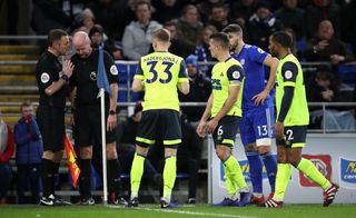 Referee Lee Mason, centre left, overturned a penalty decision at Cardiff in January