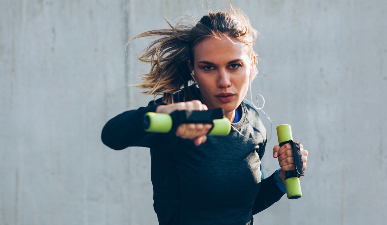 Woman doing boxercise with weights