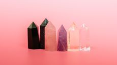 various crystals against pink background 