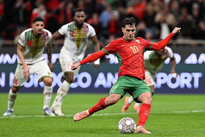 Morocco's forward #10 Brahim Diaz shoots from the penalty spot to score the team's first goal during the Africa Cup of Nations (CAN) Group A football match between Morocco and Mali at Prince Moulay Abdellah Stadium in Rabat on December 26, 2025. (Photo by Gabriel BOUYS / AFP)