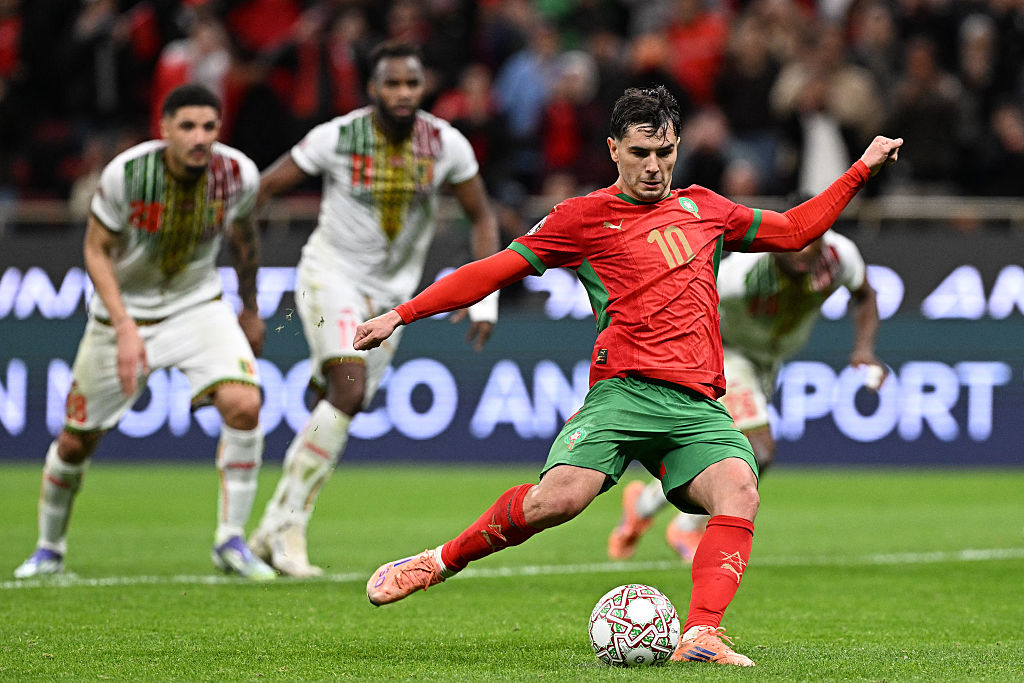 Morocco's forward #10 Brahim Diaz shoots from the penalty spot to score the team's first goal during the Africa Cup of Nations (CAN) Group A football match between Morocco and Mali at Prince Moulay Abdellah Stadium in Rabat on December 26, 2025. (Photo by Gabriel BOUYS / AFP)