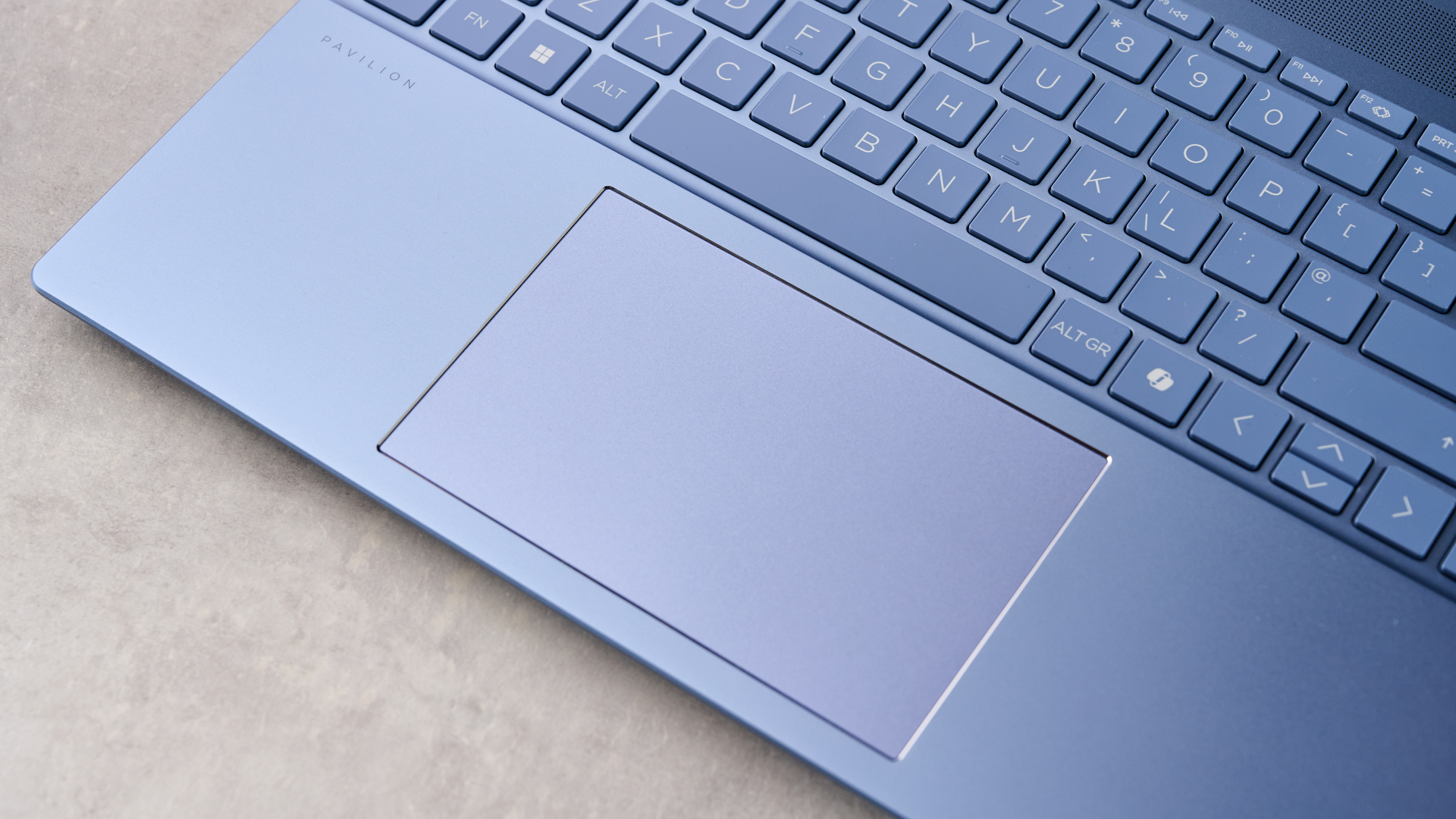 Close-up of touchpad on HP Pavilion 16, on a desk