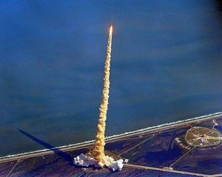 Space shuttle launch seen from the air