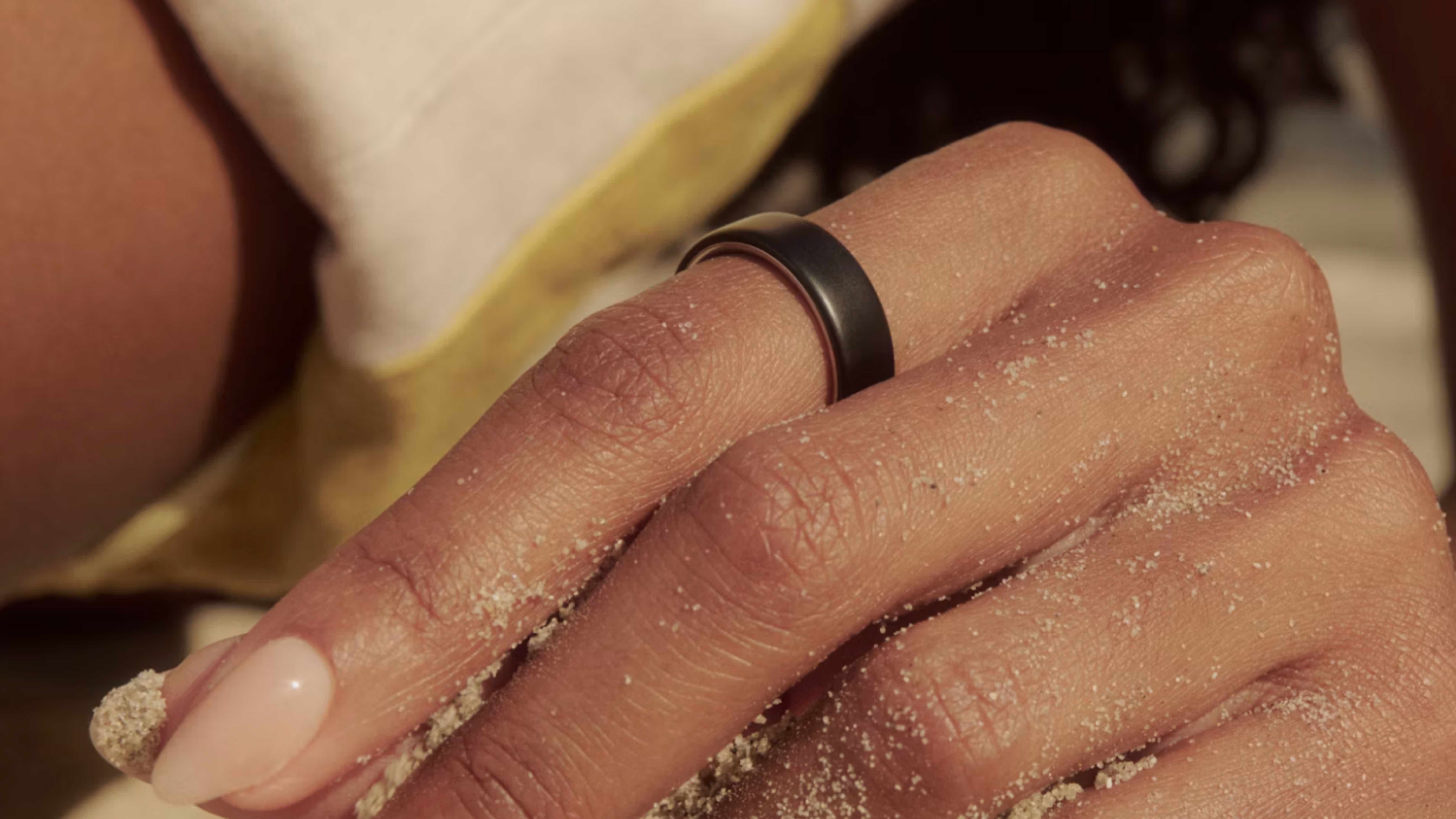 The Oura Ring 5 and companion app in lifestyle images.