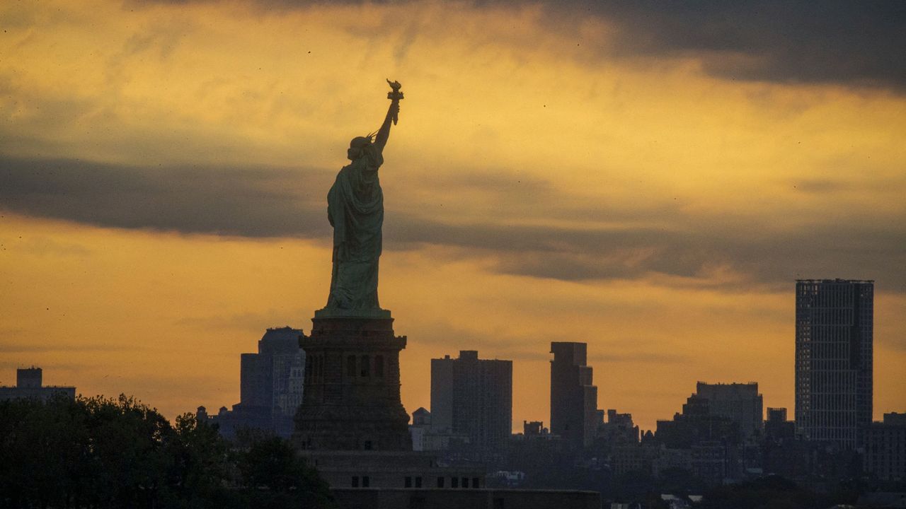 The Statue of Liberty seen against the eerie sky of the June 10, 2021, solar eclipse, as photographed by Kena Betancur.