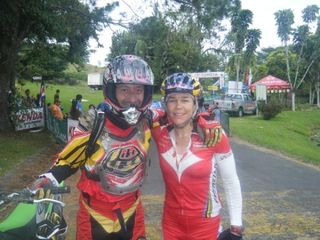 Lead moto driver Frederico with Rebecca Rusch at the finish. He was her motivation on stage 3.