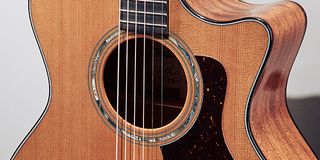 A detail showing the sound hole of a Taylor Legacy 514CE Grand Auditorium