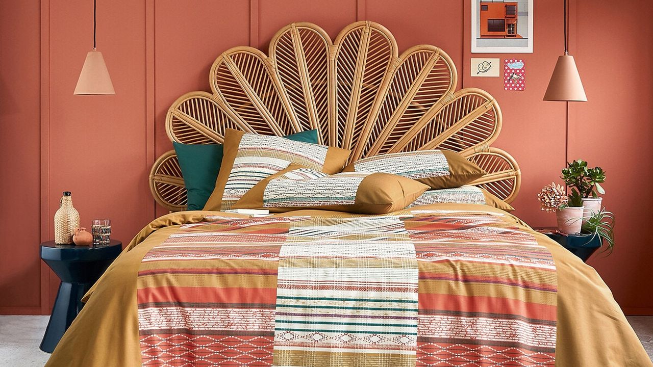 Petal cane headboard, colourful bedding sheets, bedside tables