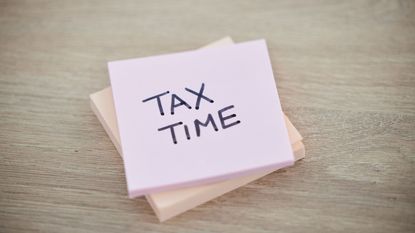 tax time written on stack of post it notes for last-minute tax tips